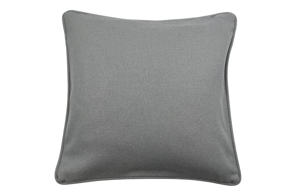 Zierkissen mit dem Bakhausen-Motiv „Zackenkrone“ in Beige, Schwarz und Grau. Das elegante Design wird durch einen unifarbenen Rückseitenstoff aus weicher Schurwolle ergänzt. Rückseitenansicht