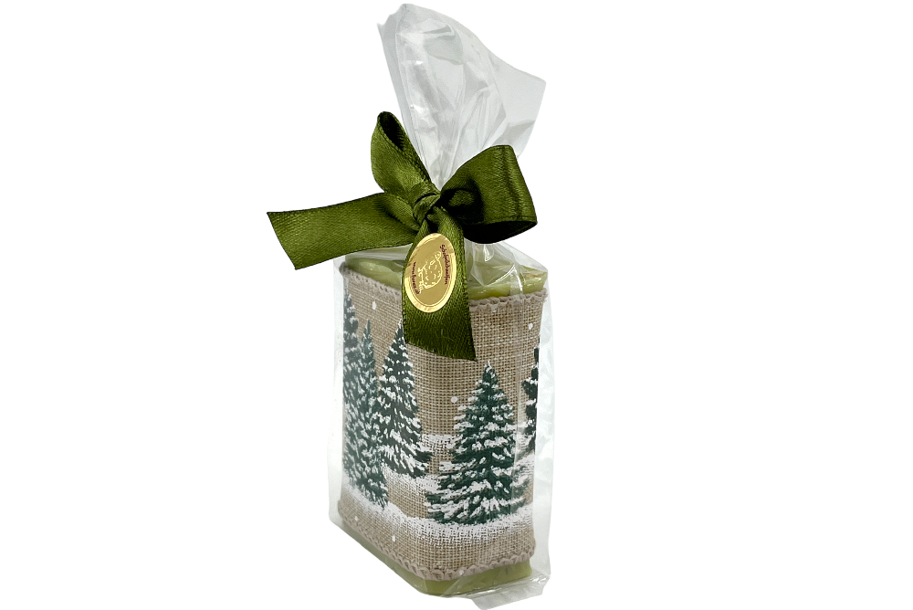 schafsmilchseife mit weihnachtsmotiv im Sackerl mit grüner Masche