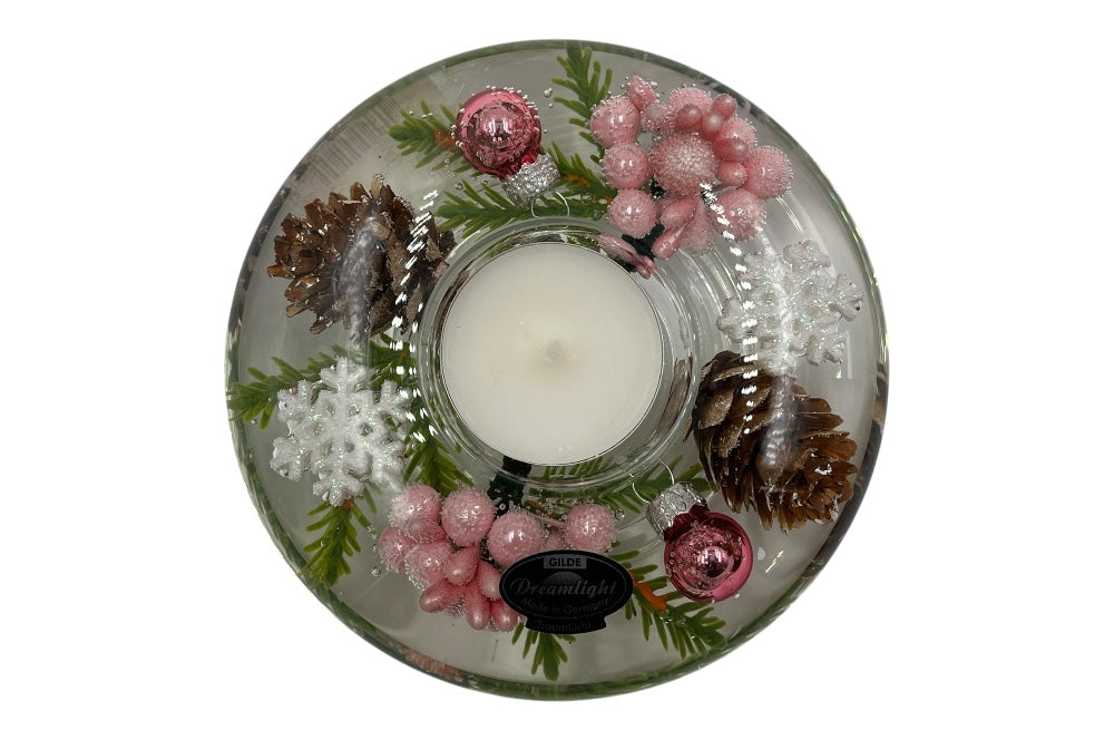 Teelichthalter aus Glas, mit rosa Perlen, rosa weihnachkugeln, Fichtenzapfen,grünen Zweigen und weißen Schneesternen gefüllt. Ansicht von oben